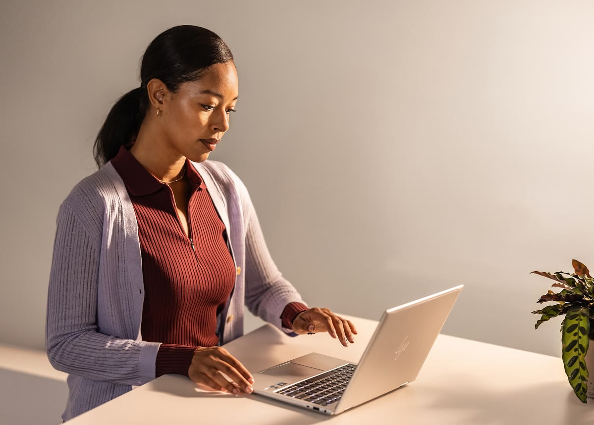 A professional working on her laptop