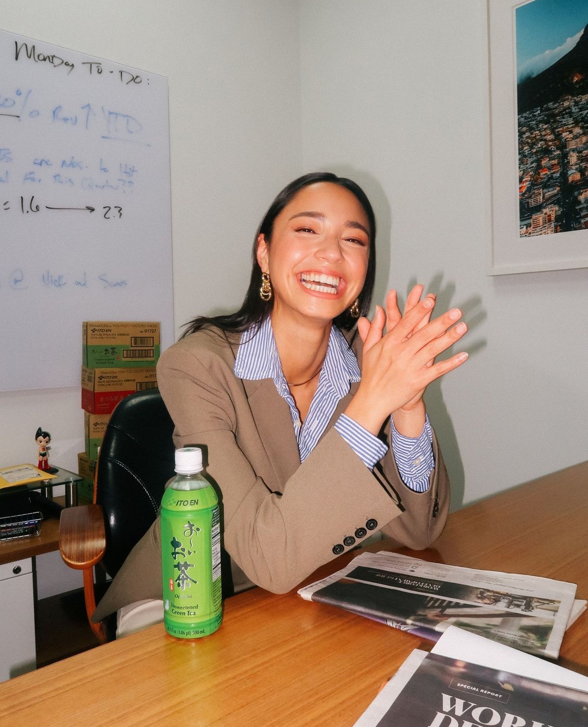 A team member celebrating at her desk